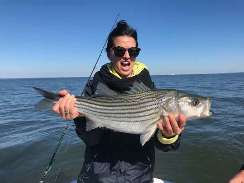 woman caught a striper in the chesapeake