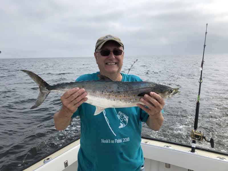 holding up a spanish mackerel