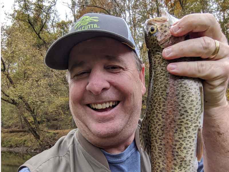 trout angler with his catch