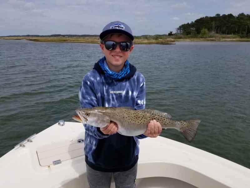 kid with a speckled trout