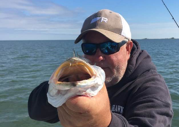 cl marshall holding a speckled sea trout