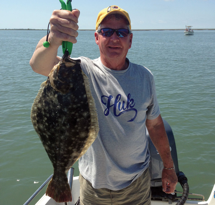 Mike Ditmars with a keeper-size Wachapreague summer flounder