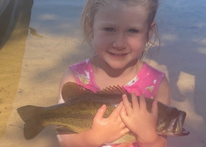 little girl goes bass fishing