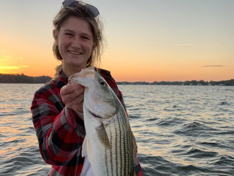 woman caught a striped bass