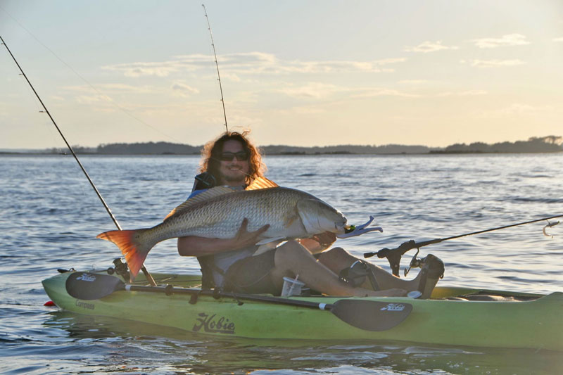 david with a mega bull redfish