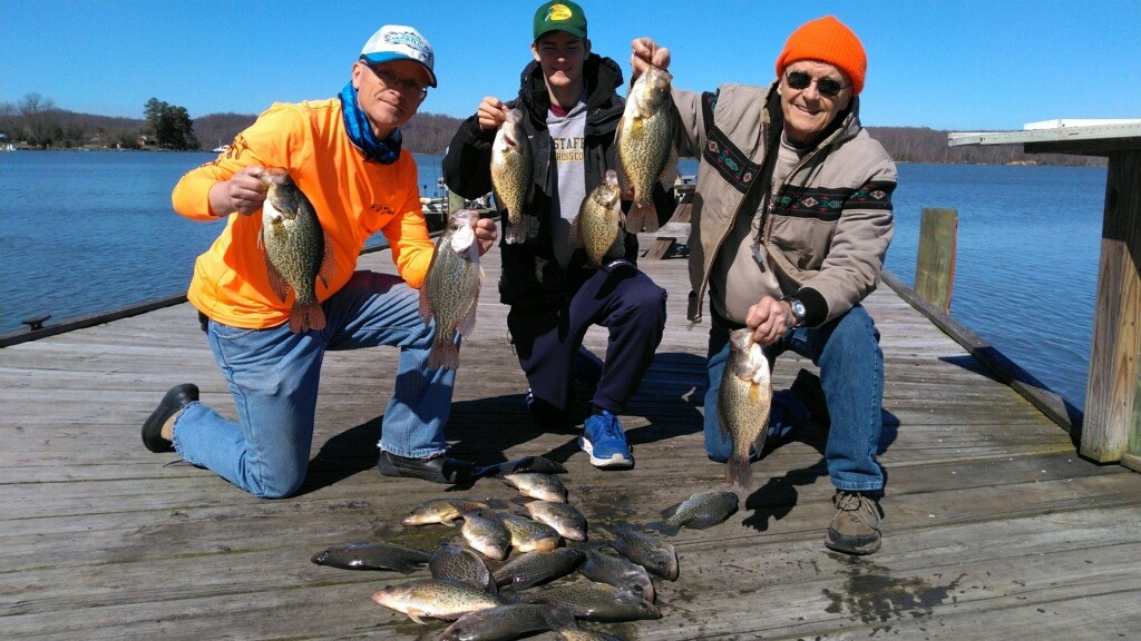anglers with a catch of crappie fish