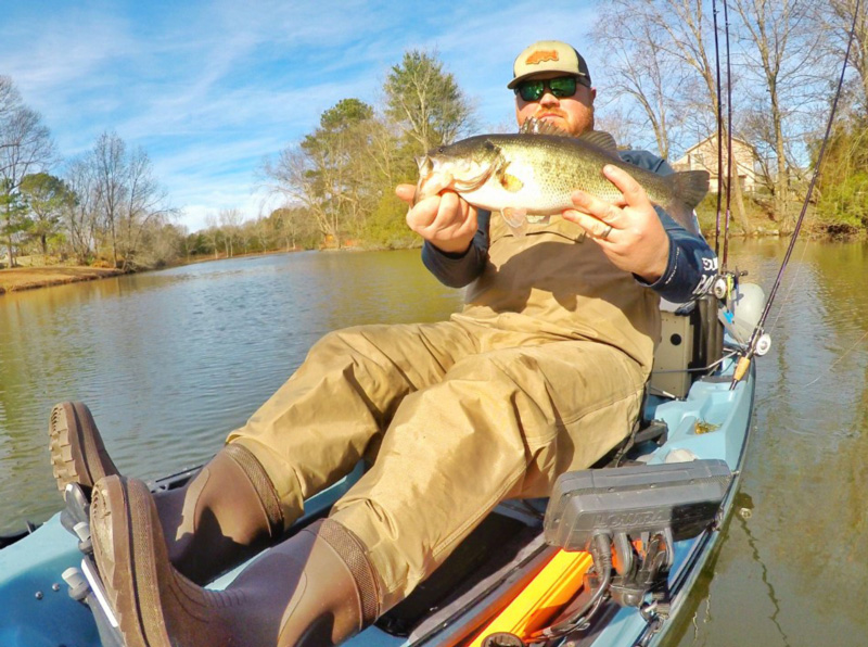 kayak angler with a bass