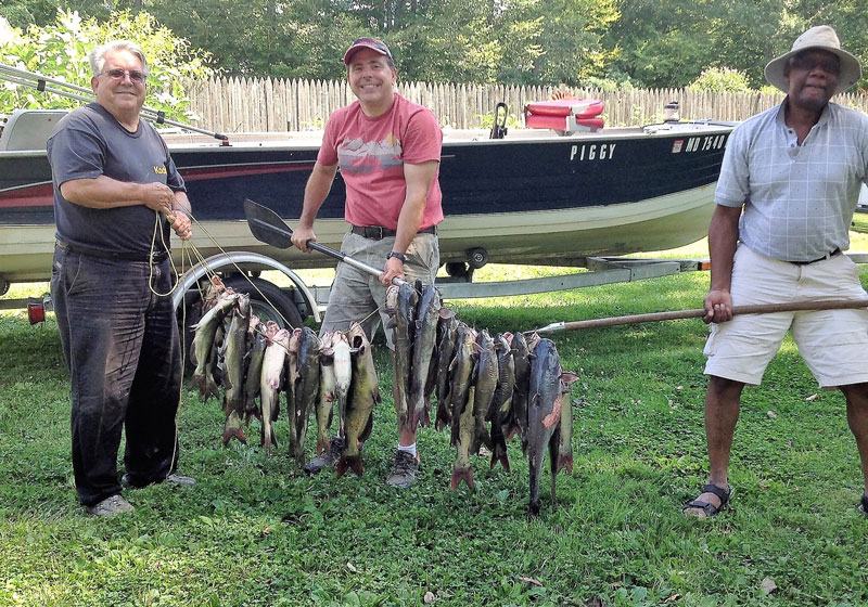 fishermen with a ton of catfish
