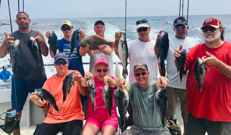 anglers with sea bass