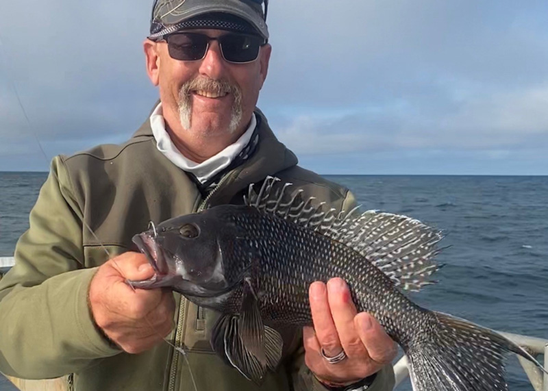 sea bass fisherman with his catch