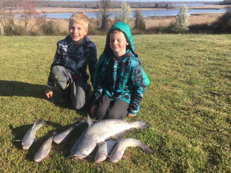 anglers with catfish caught during covid-19 emergency
