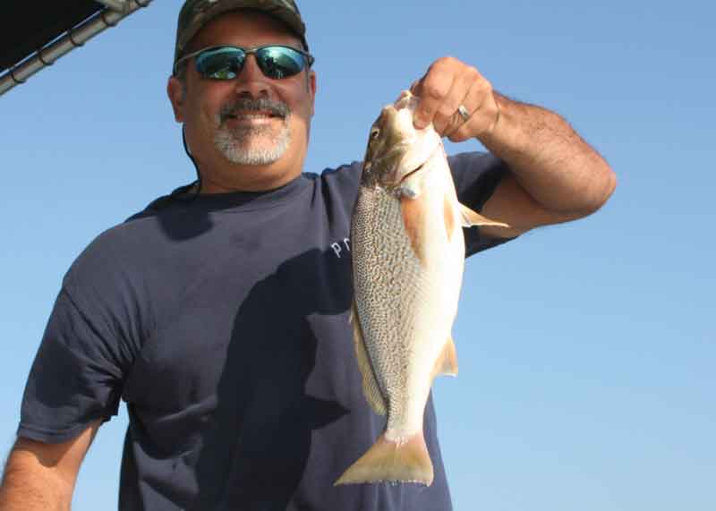 fisherman with a croaker