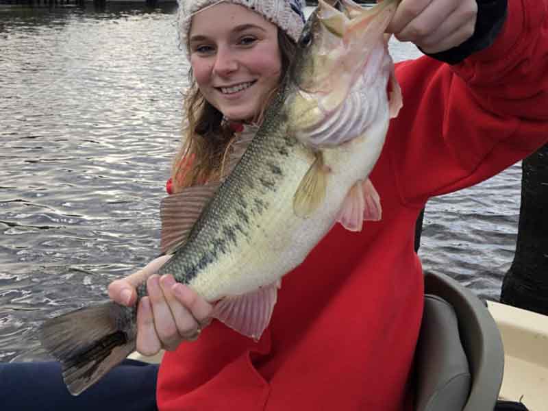 girl catches a big bass