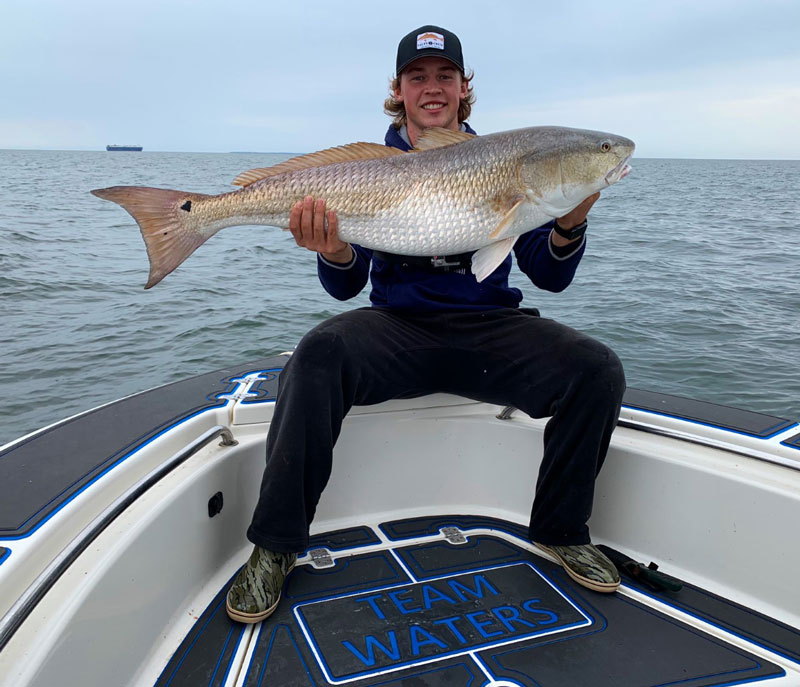 dillon with a monster red drum