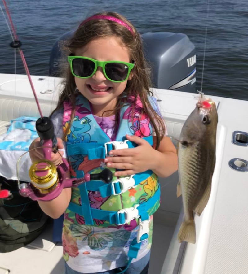 fisher girl catches a fish