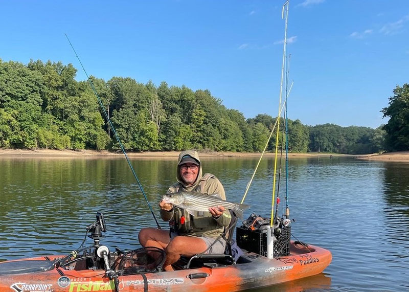 kayak angler with fishing rods
