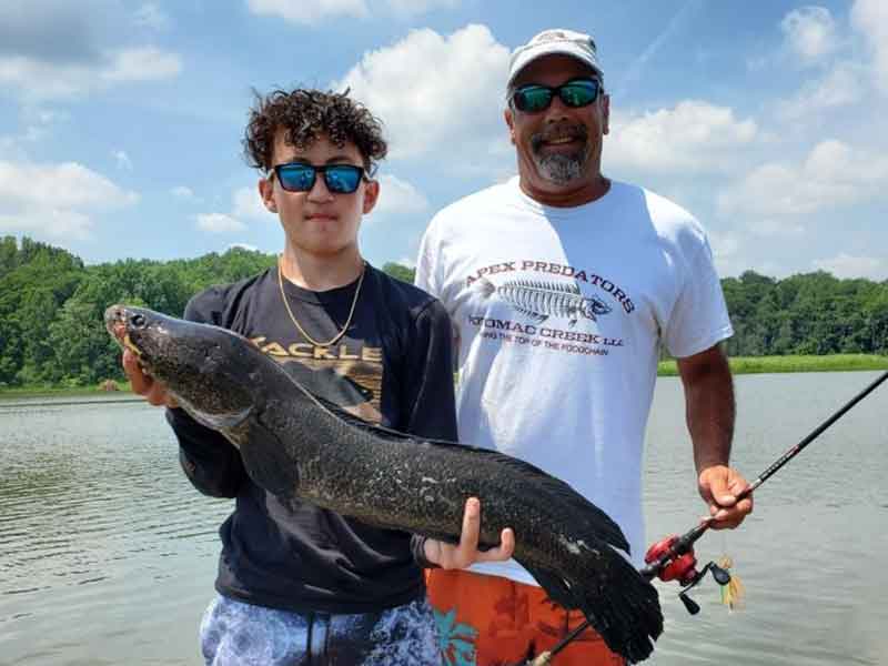 angler and guide with a snakehead