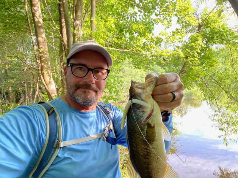 angler with a bass