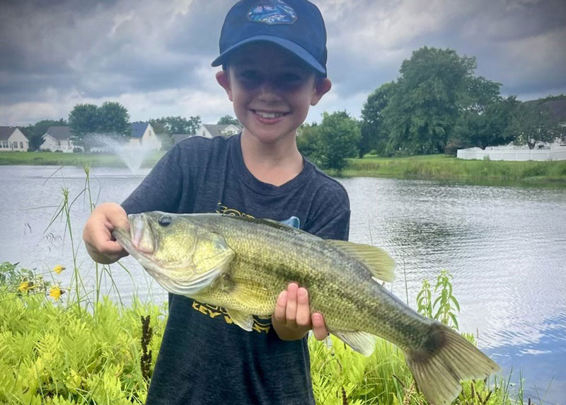 kid fishing caught a big bass