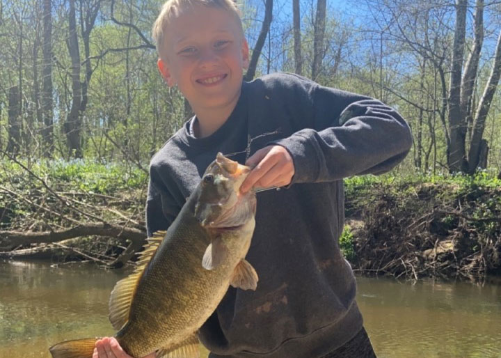 kid holding a bass