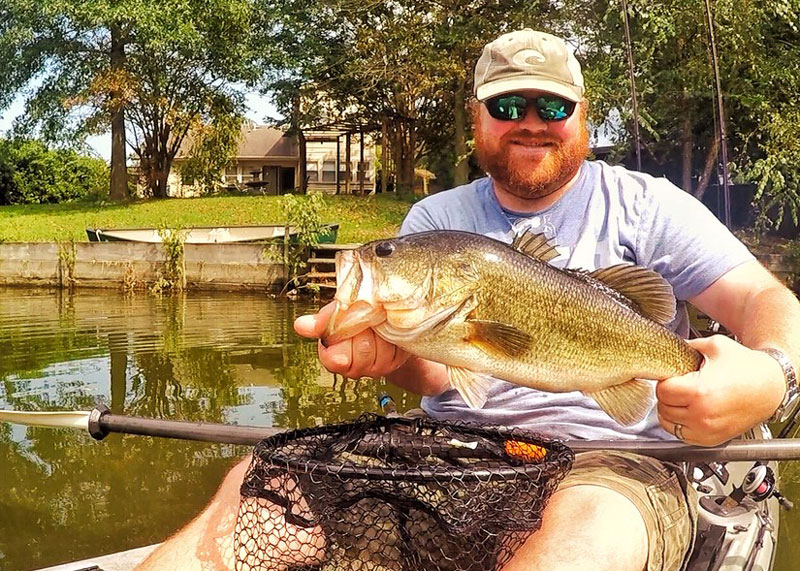 big largemouth bass on a kayak