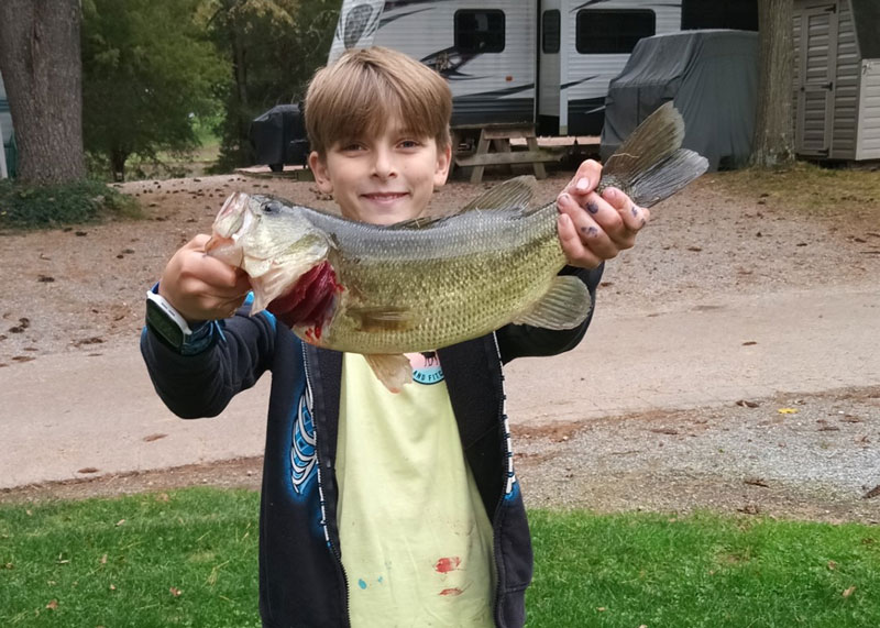 freshwater angler with a bass