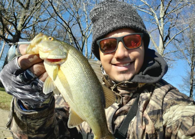 junior caught a bass freshwater fishing
