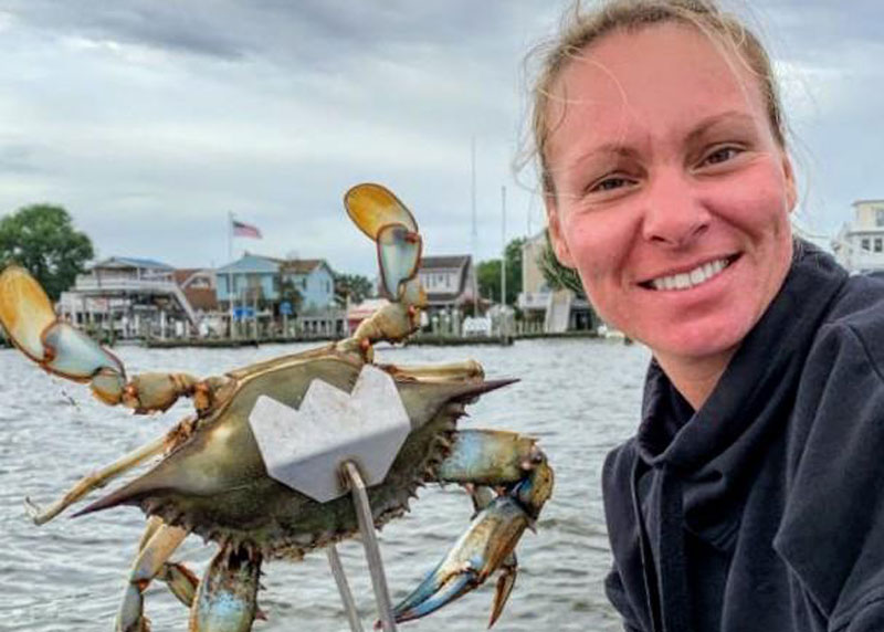 woman with a huge crab she caught