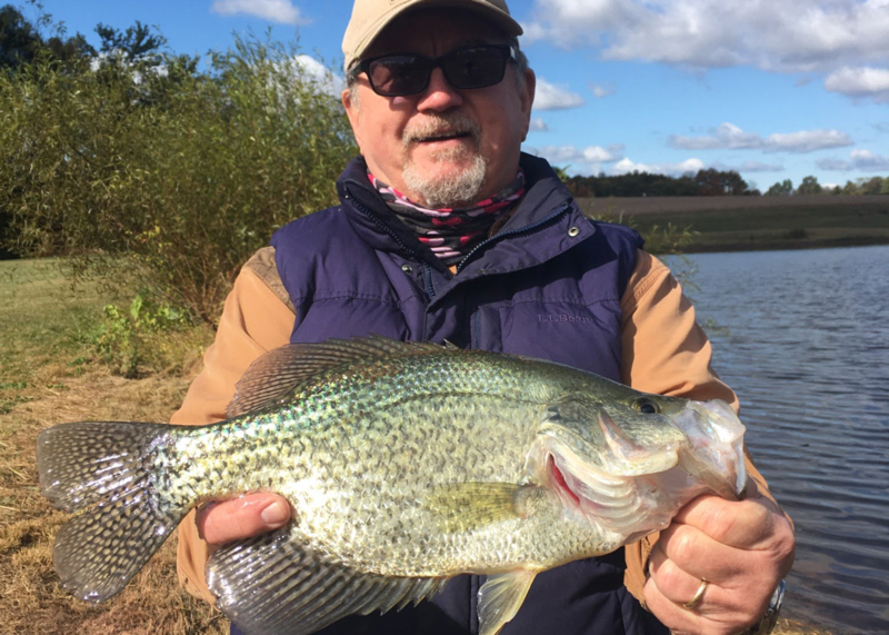 angler with a huge crappie