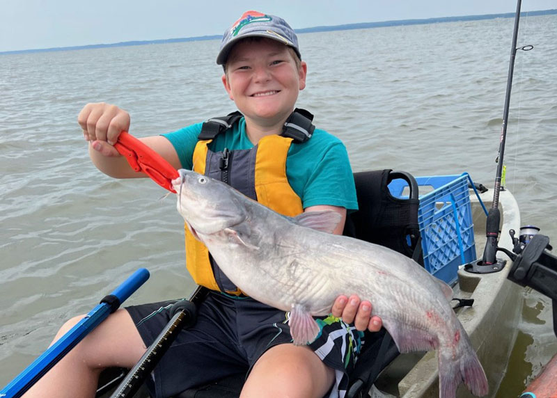 kayak angler with a blue catfish