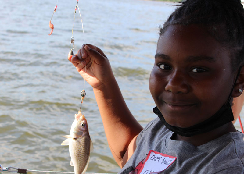a kid caught a croaker