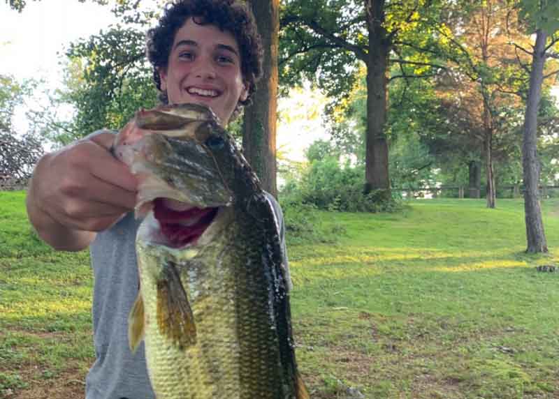 bass fisherman with his catch