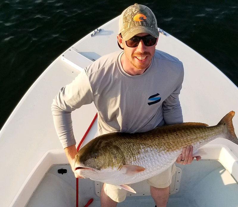 big red drum caught fishing on a boat