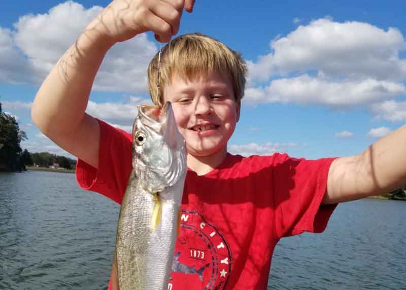 sea trout caught by a kid