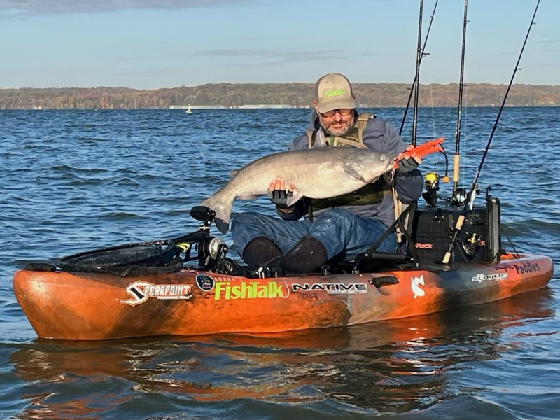 kayak angler with catfish