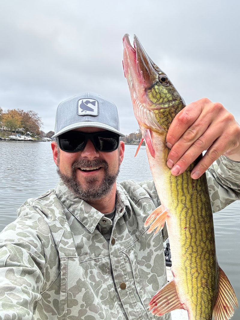 angler wearing magellan outdoors jacob wheeler collection while fishing
