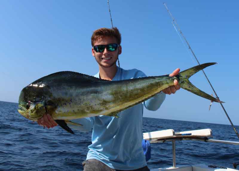 angler with a mahi