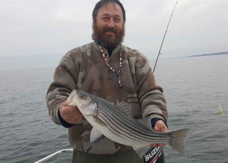 fred holds up a fish