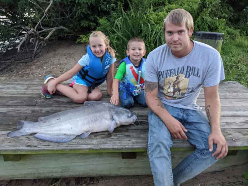 kids with huge catfish