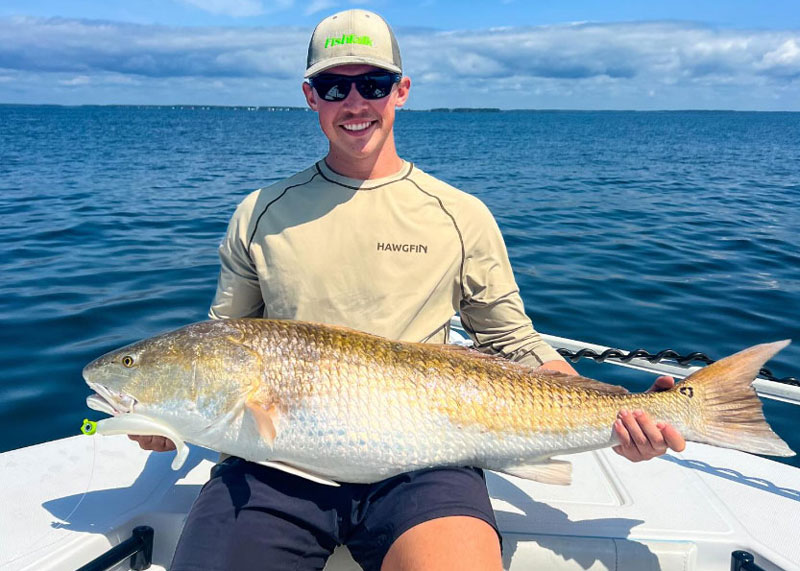 fishing report editor dillon with a huge redfish