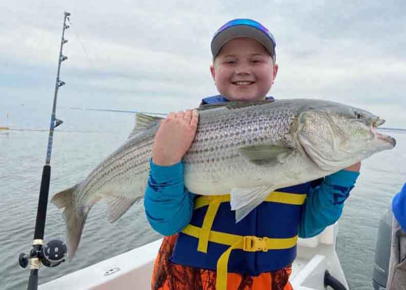 boy with rockfish