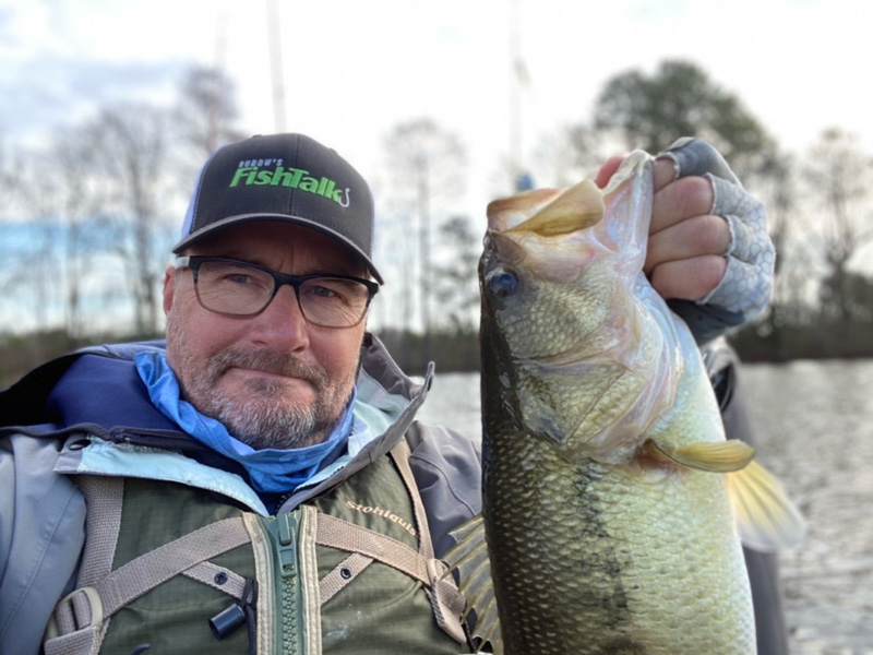 bass angler who is freshwater fishing