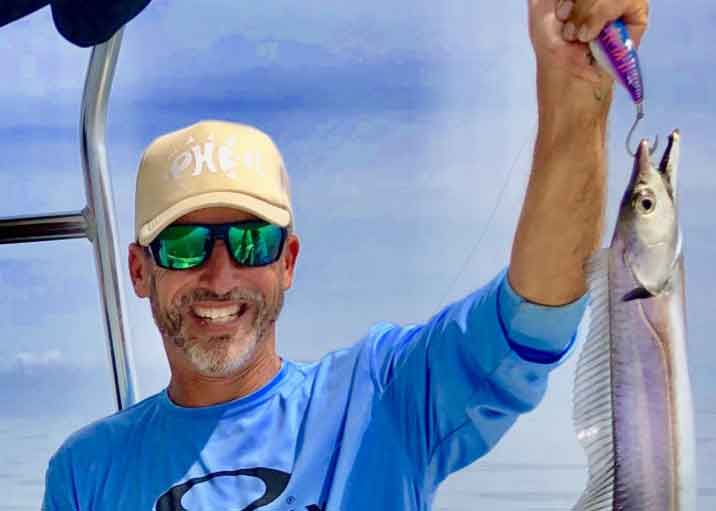 holding up a ribonfish