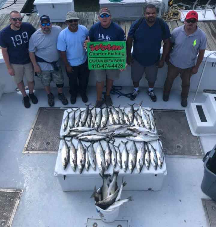 big worm charter boat with a big catch