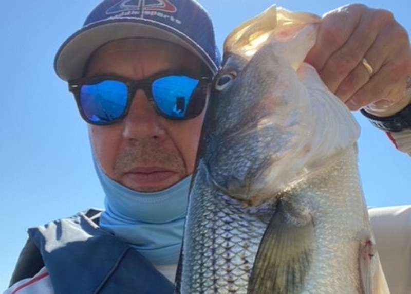 kayak angler with a nice rock