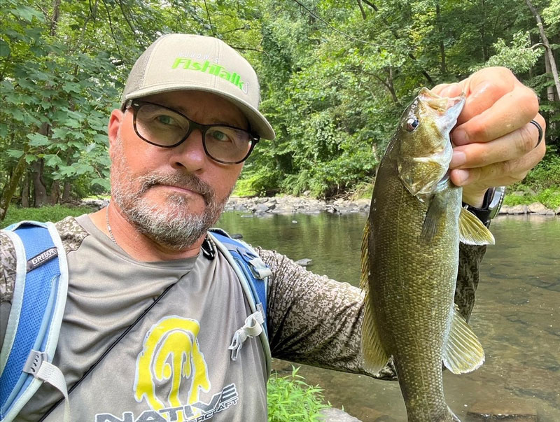 smallmouth bass caught fishing in a river