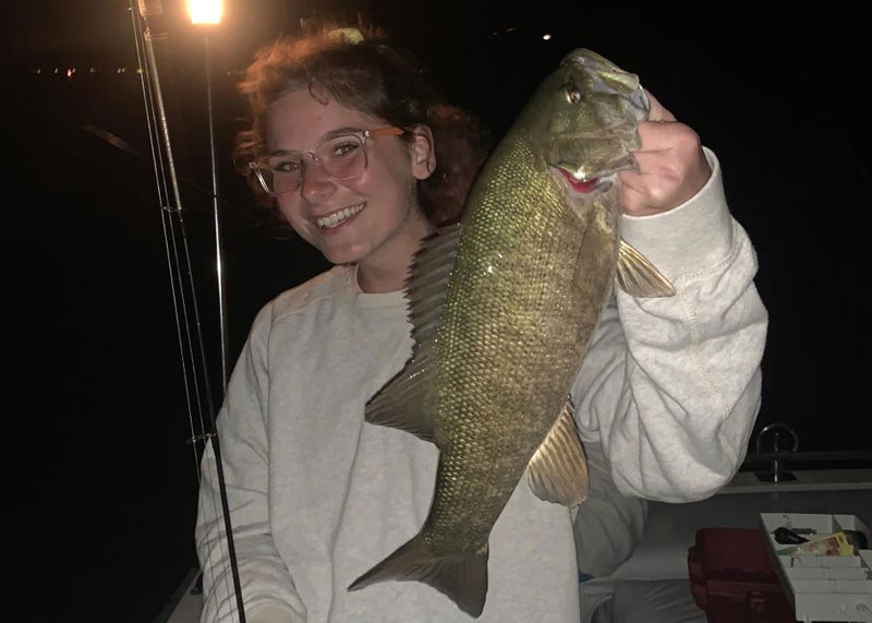 mollie caught a smallmouth bass at night