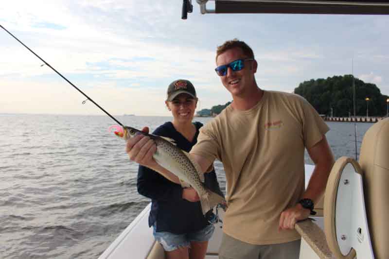 angler with a speckled trout