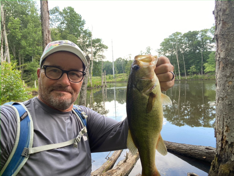 author holding a bass