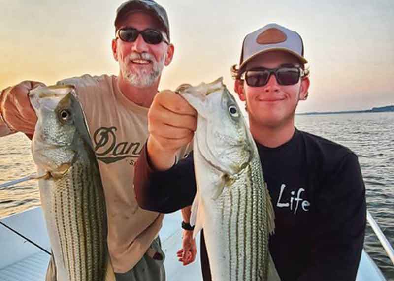 happy anglers with rockfish